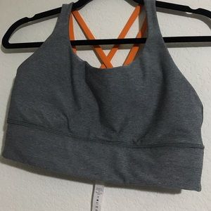 Orange and grey lululemon sports bra